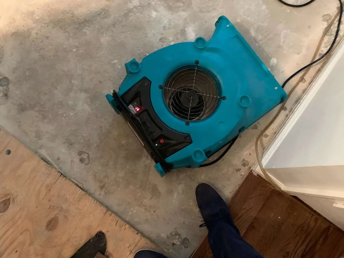 Air mover drying subfloor during Leak Detection & Repair in Temescal Valley